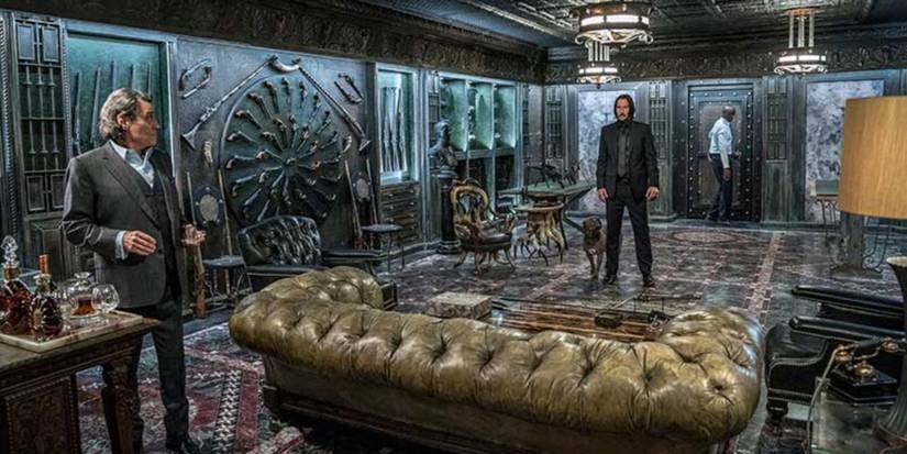 John, Winston, and Charon in the weapon room in John Wick Chapter 3 – Parabellum