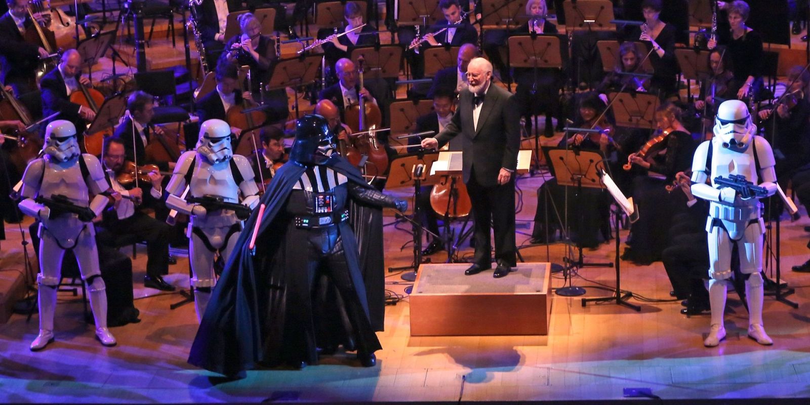 John Williams on stage with Darth Vader and Stormtroopers