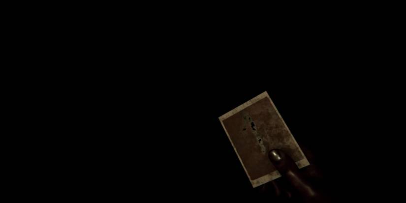 A visual of MADiSON's polaroid gameplay feature, where the polaroid has immediately decayed and turned bloody.