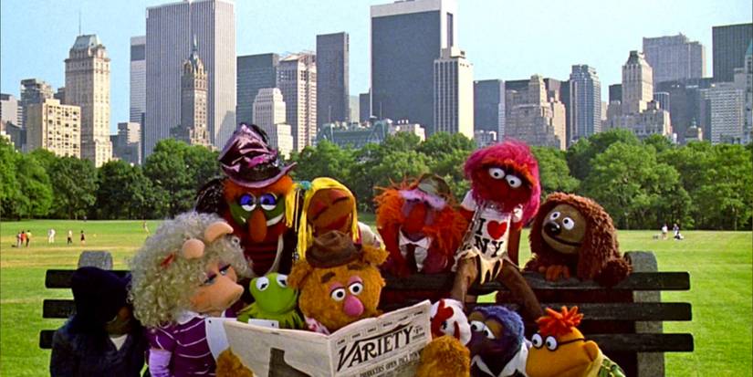 A group of Muppets reading the newspaper in Central Park