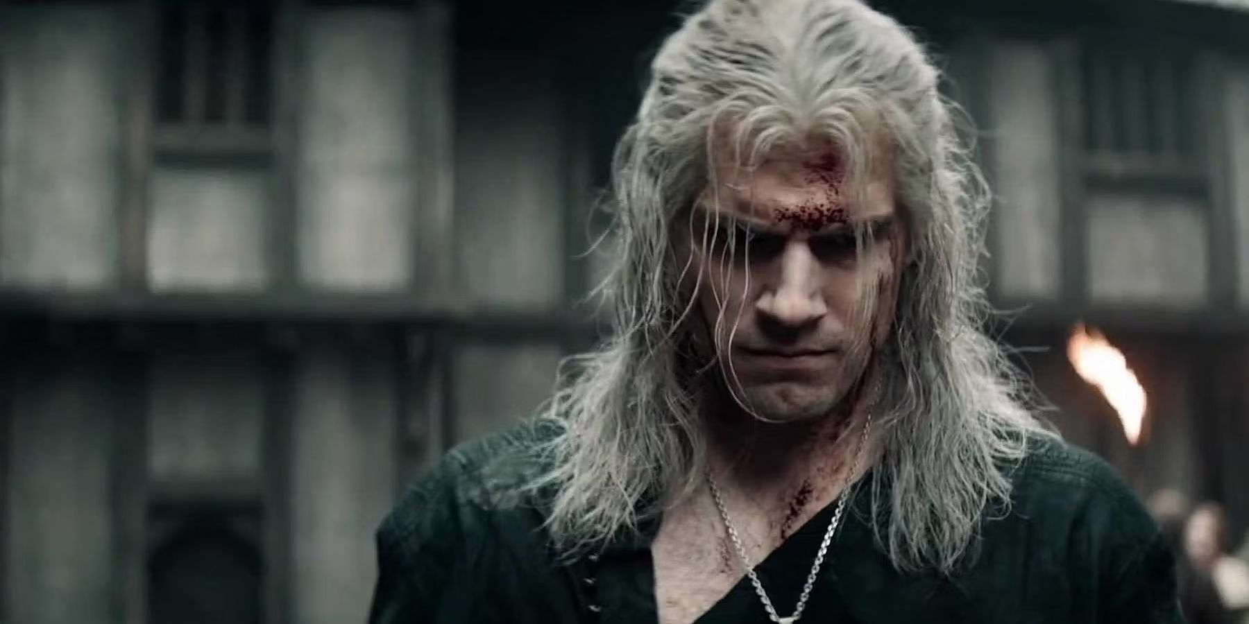 Henry Cavill looking down as Geralt of Rivia The WItcher