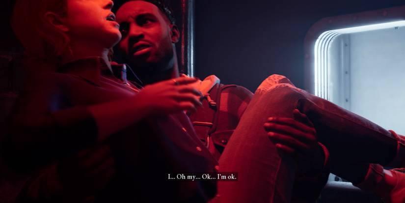 Kate being lifted out of the containment room by Mark