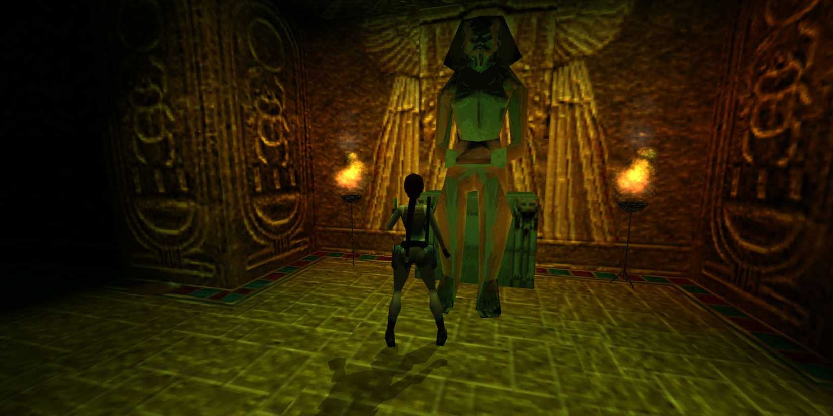 Lara standing in front of an ancient Egyptian statue in Tomb Raider: The Last Revelation.