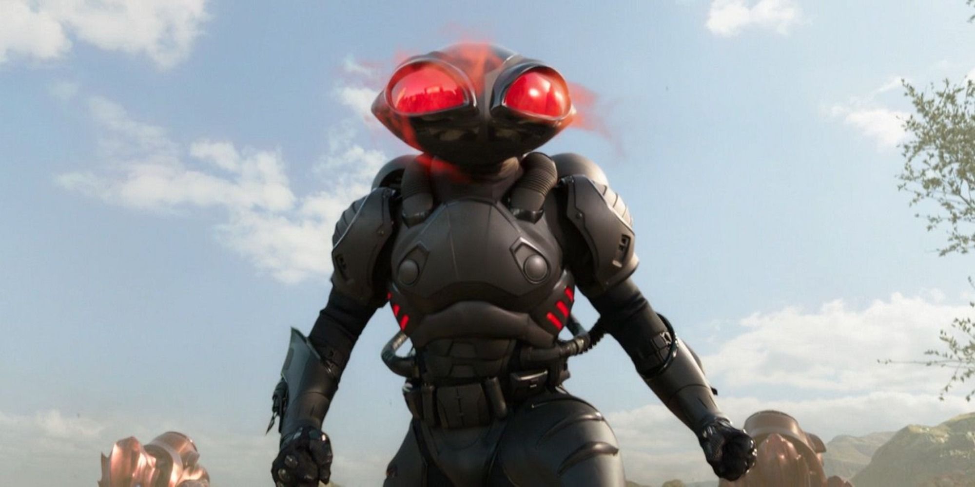 black manta standing menacingly with glowing red eyes from the Aquaman movie