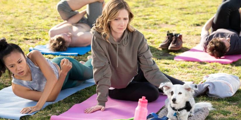 Judy Greer sitting in a park in the "Good Boy" Into The Dark episode