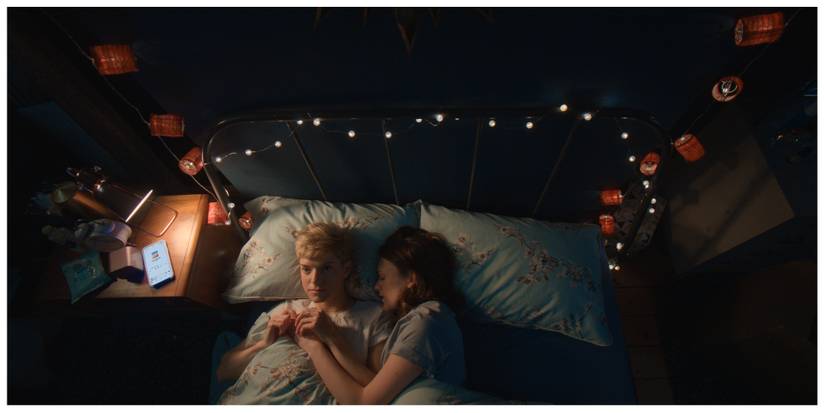 May and George from Feel Good in bed, George is asleep and May is staring at the ceiling.