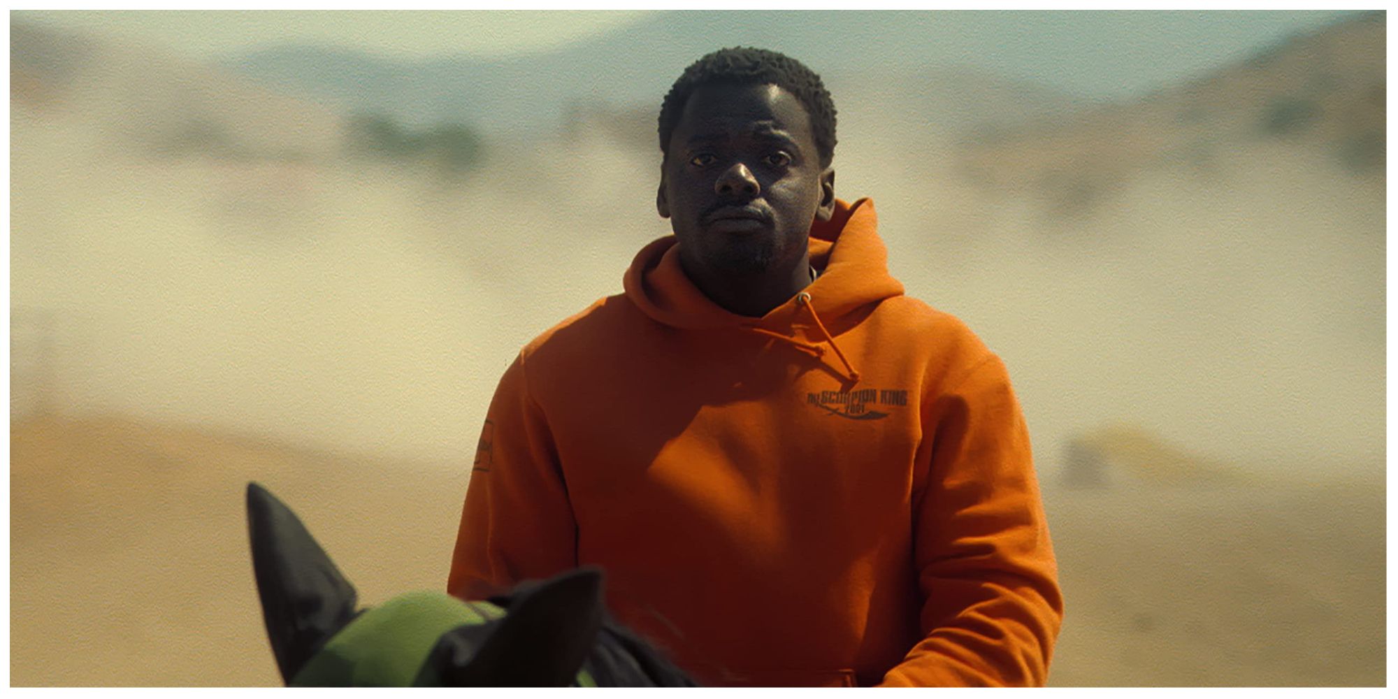 Daniel Kaluuya as Haywood Jr. riding a horse through the desert