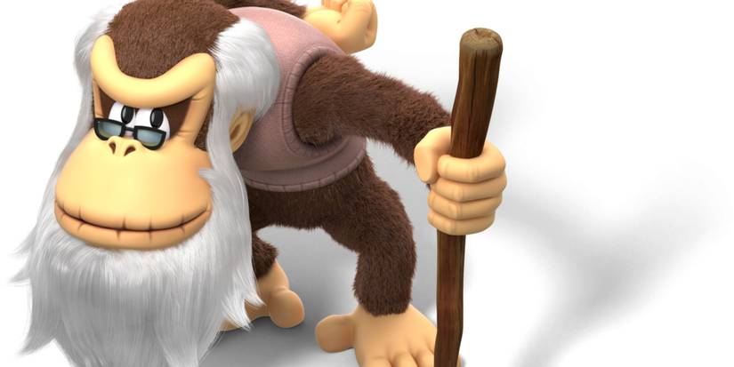 Crankey Kong in a sweater vest, glasses and walking stick