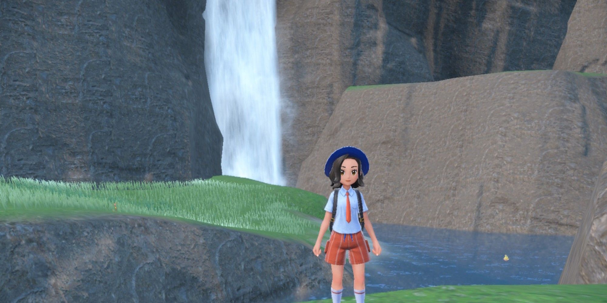 a player standing in front of a waterfall