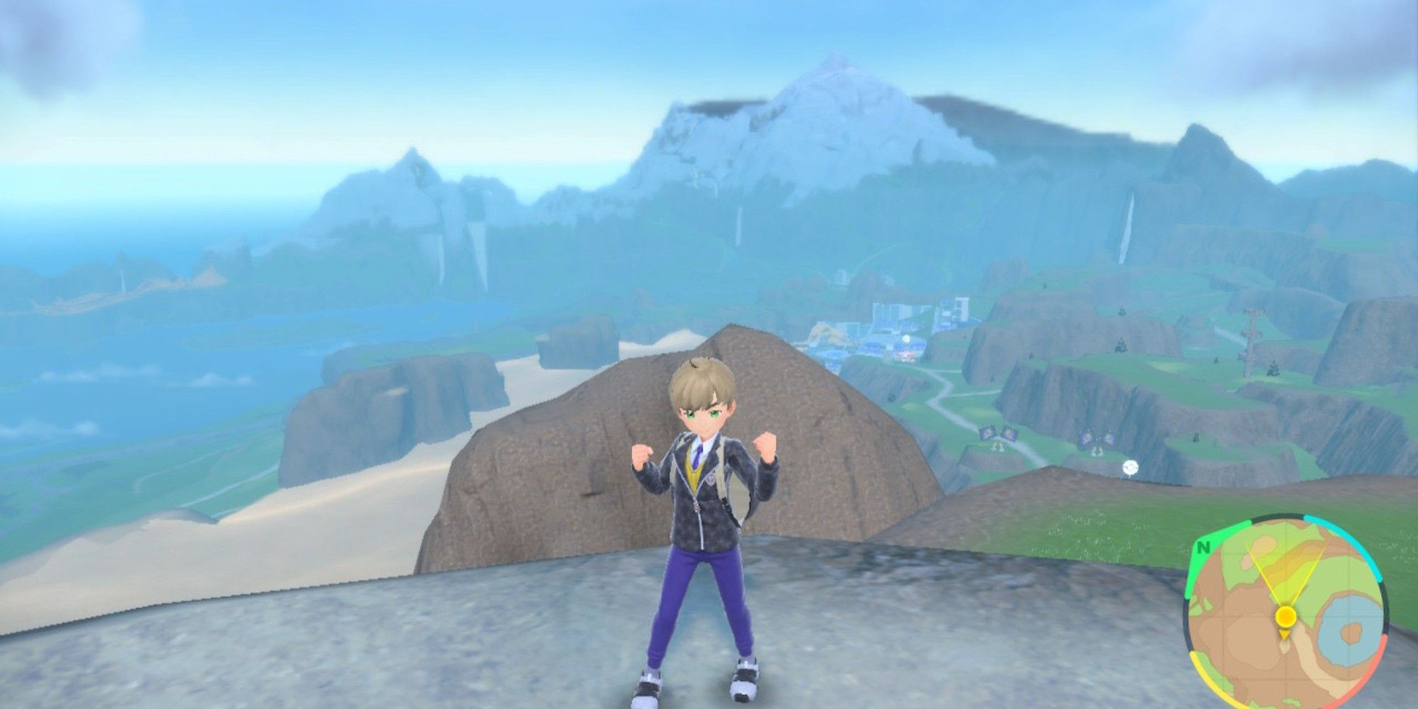 the player on top of a mountain. more mountains are in the back