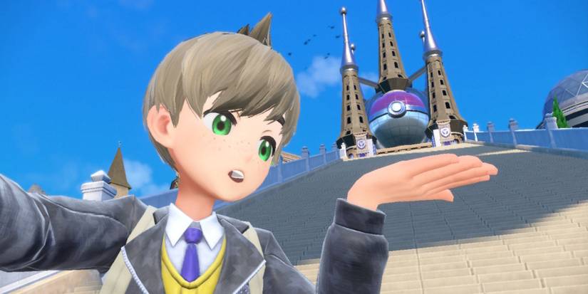 the player posing a selfie near the stairs to the school