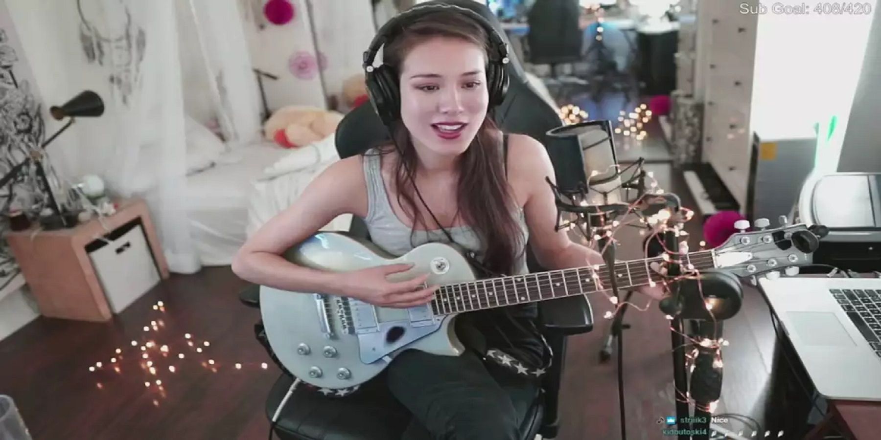 Twitch Streamer Indieefoxx holding a guitar