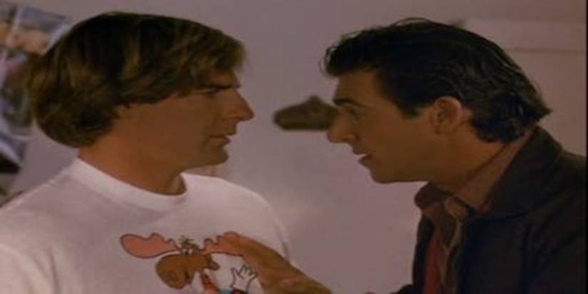 Frank Lamotta talks to Sam Beckett in a white tshirt with an elk on it, Sam is confused as to who he is