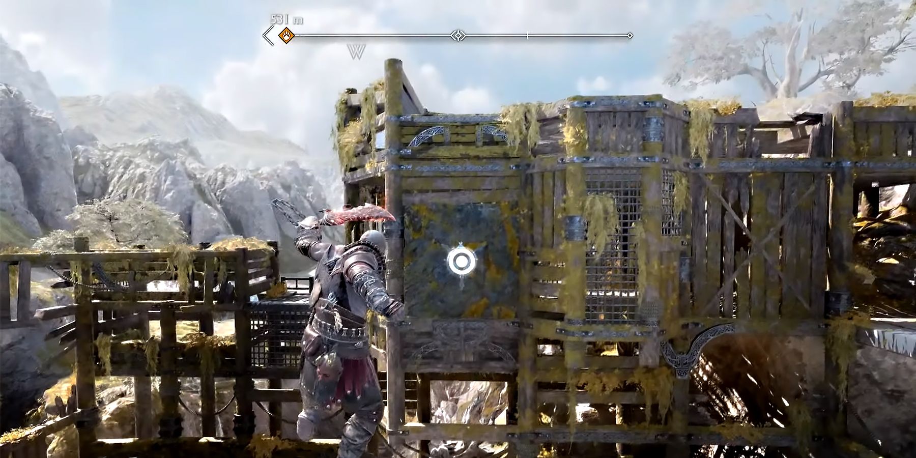 kratos breaking a stone wall in god of war ragnarok