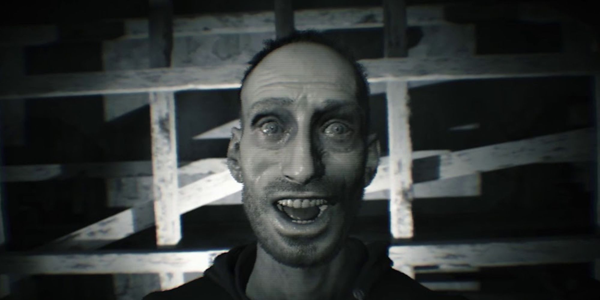 Lucas smiling into a camera in Resident Evil 7