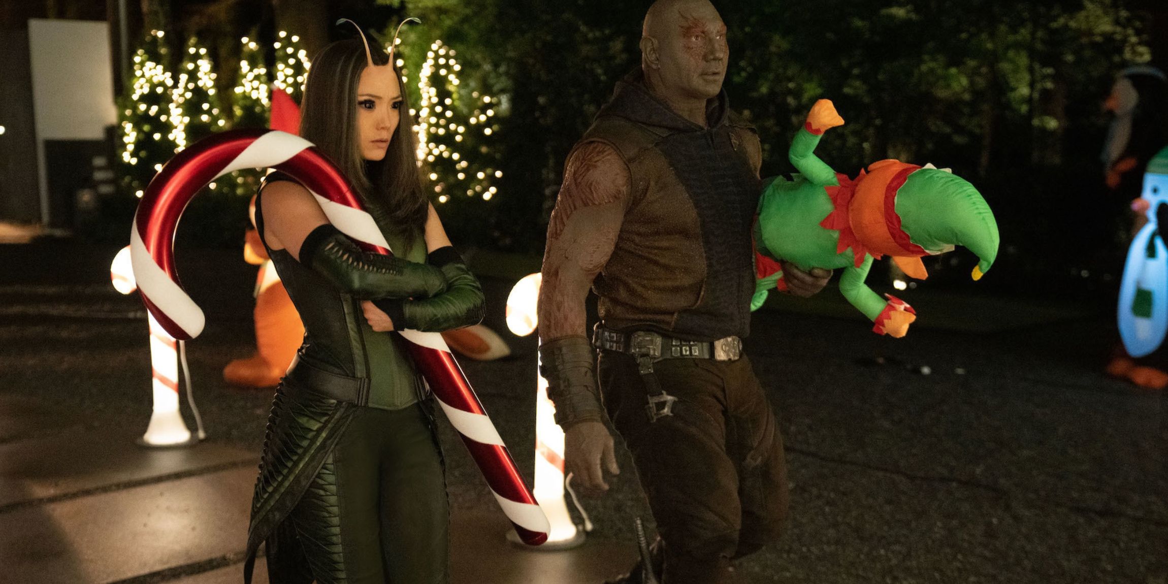 Mantis and Drax holding Christmas lawn ornaments in Guardians of the Galaxy Holiday Special