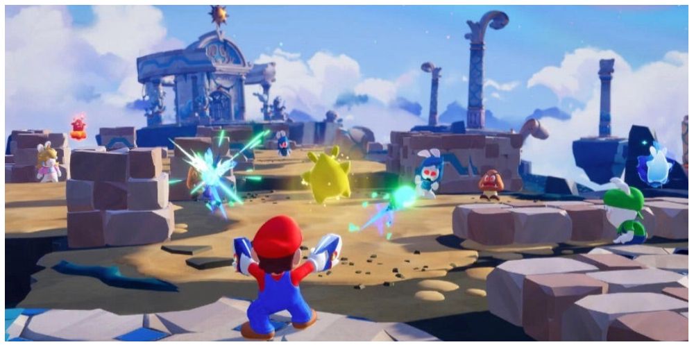 Mario, Rabbid Peach, and Rabbid Luigi in battle with their Sparks in Mario + Rabbids: Sparks of Hope