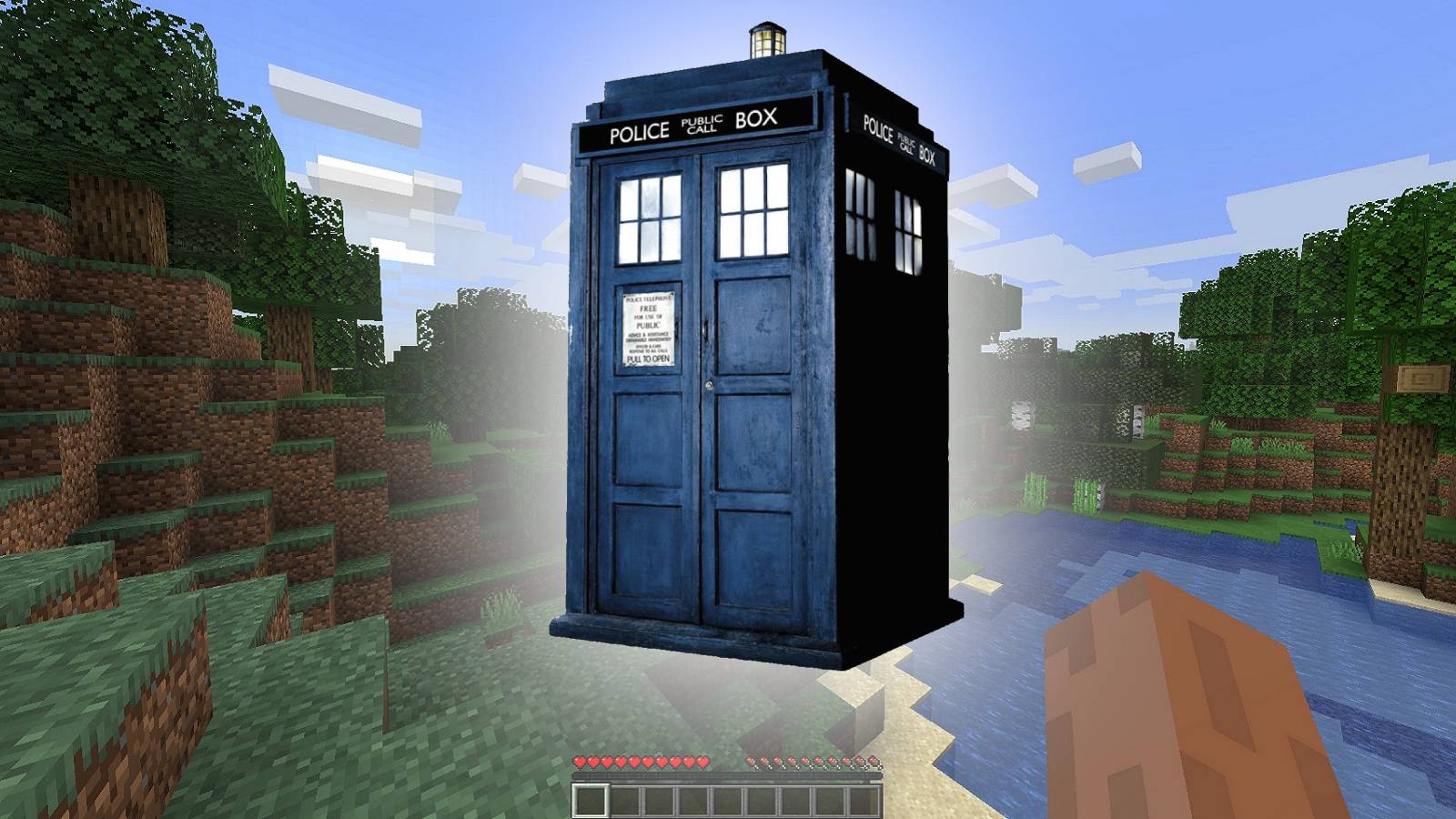 Image from Minecraft showing the TARDIS from Doctor Who floating above the ground.