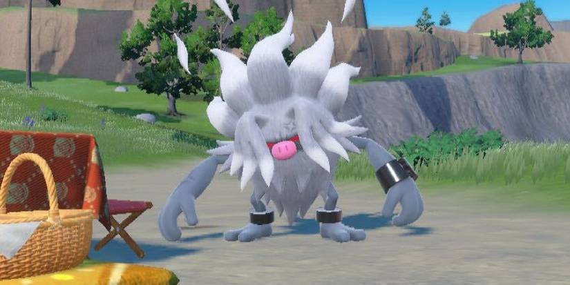 Annihilape standing near a picnic table