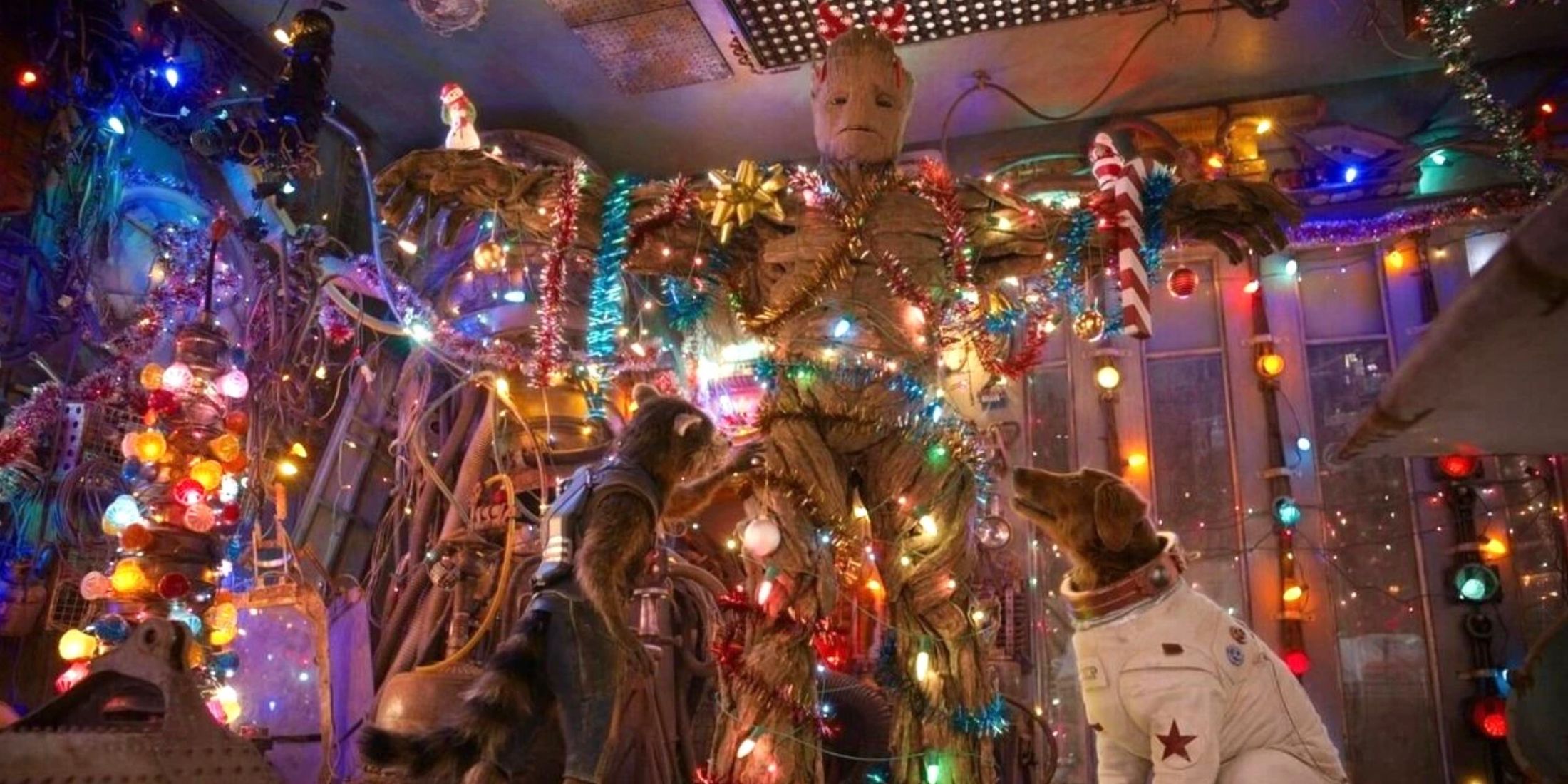 Rocket and Cosmo decorating Groot with ornaments and lights in Guardians of the Galaxy Christmas special