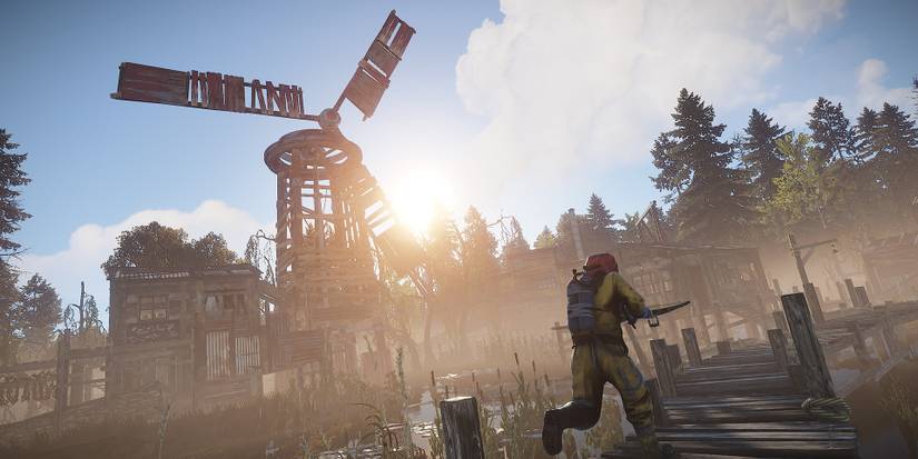 rust player running on a boardwalk with a windmill the background 