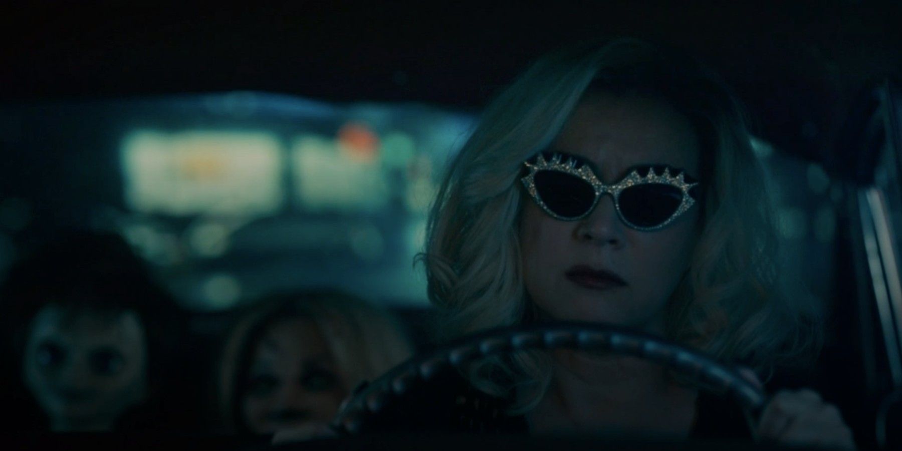 Jennifer Tilly driving Glen and Tiffany dolls in Chucky season 2