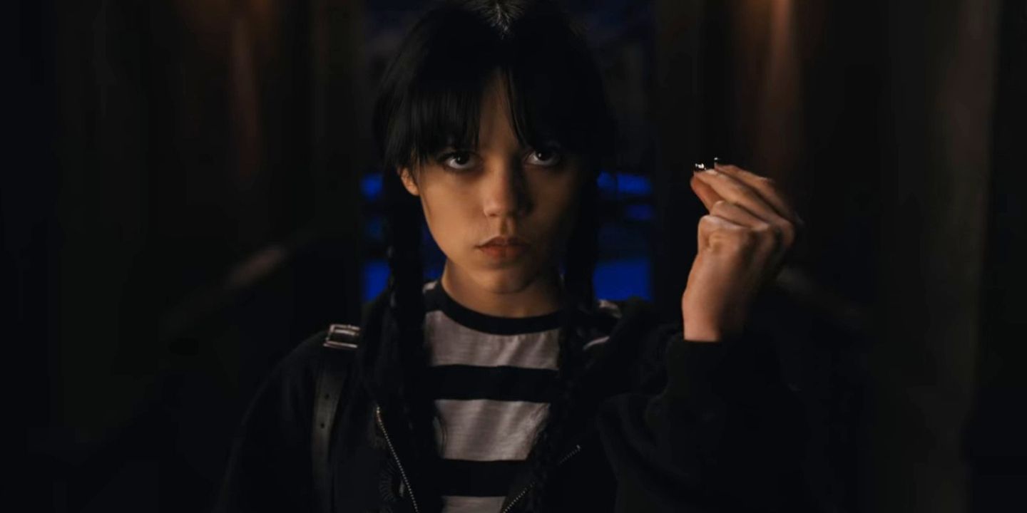 Wednesday Addams snapping her fingers in the 2022 spinoff series