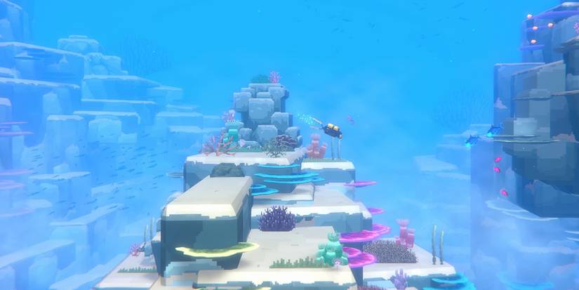 dave the diver diving near coral