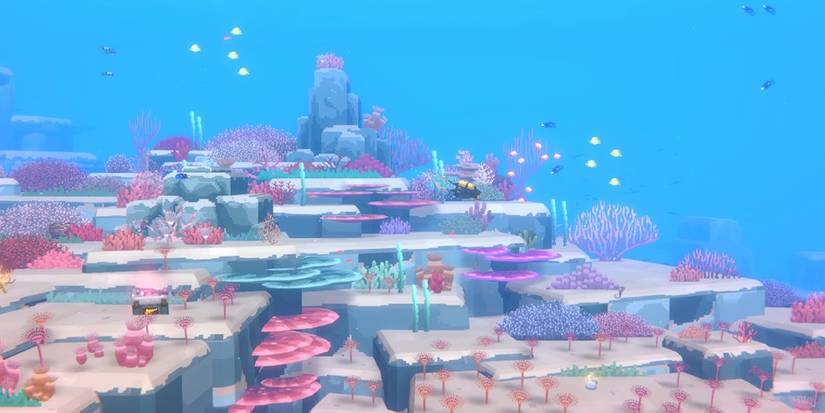 dave the diver diving near coral