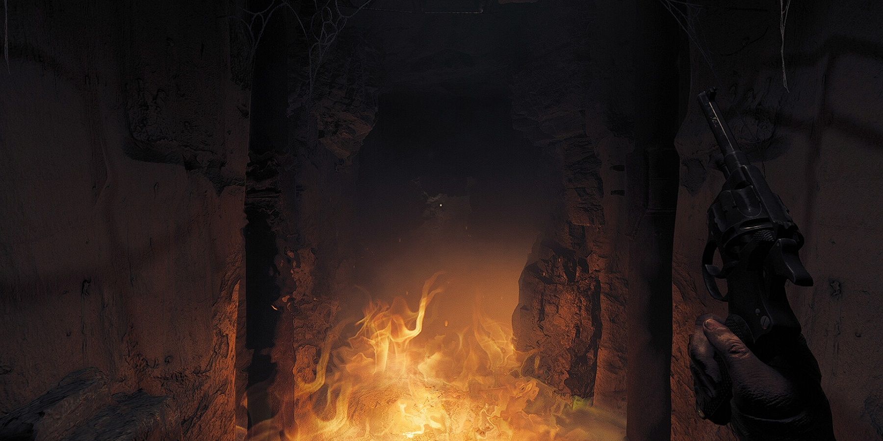 Image from Amnesia: The Bunker showing a darkened corridor on fire.