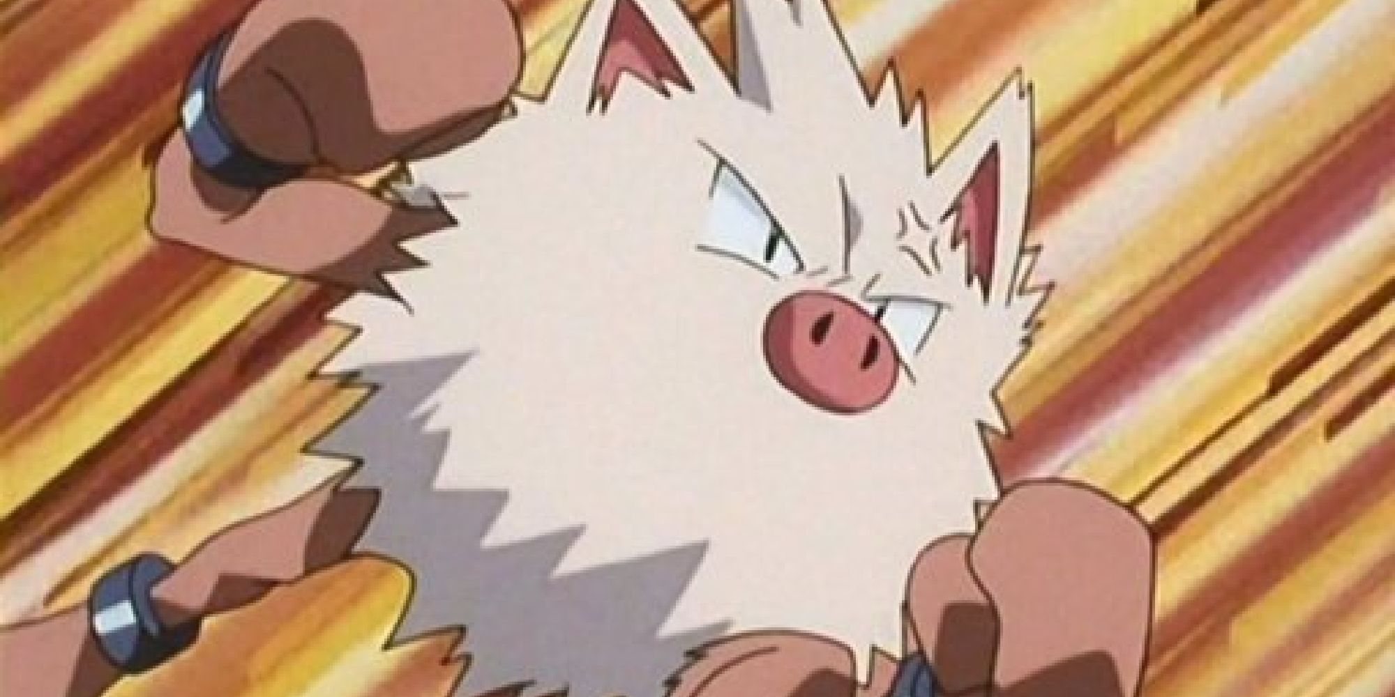 Primeape raising its fist mid-battle in the anime