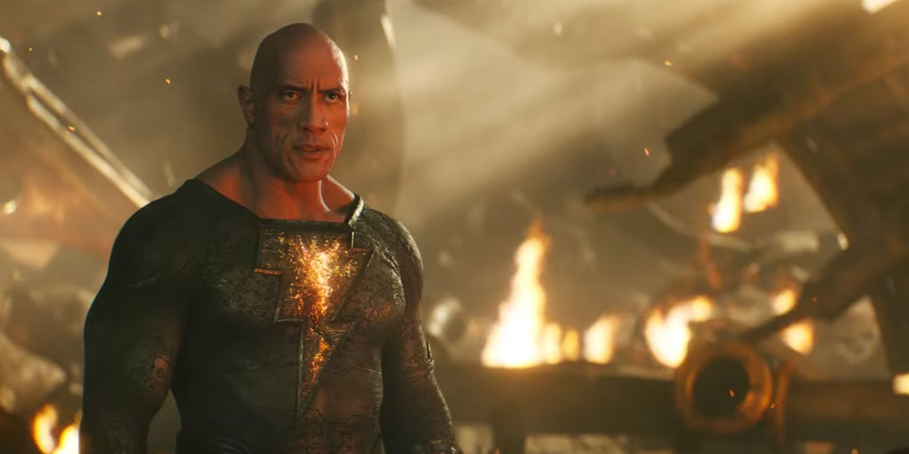 Dwayne Johnson as Black Adam in action scene with fiery background