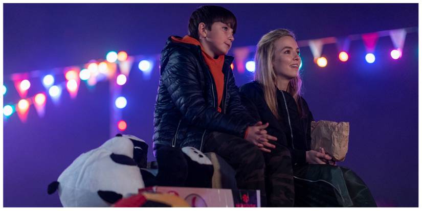 Villanelle sat at the fairground with her younger brother, Bor'ka.