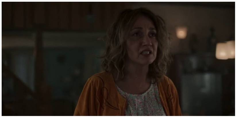 Villanelle's mother, Tatiana, looking upset as she looks at Villanelle offscreen.