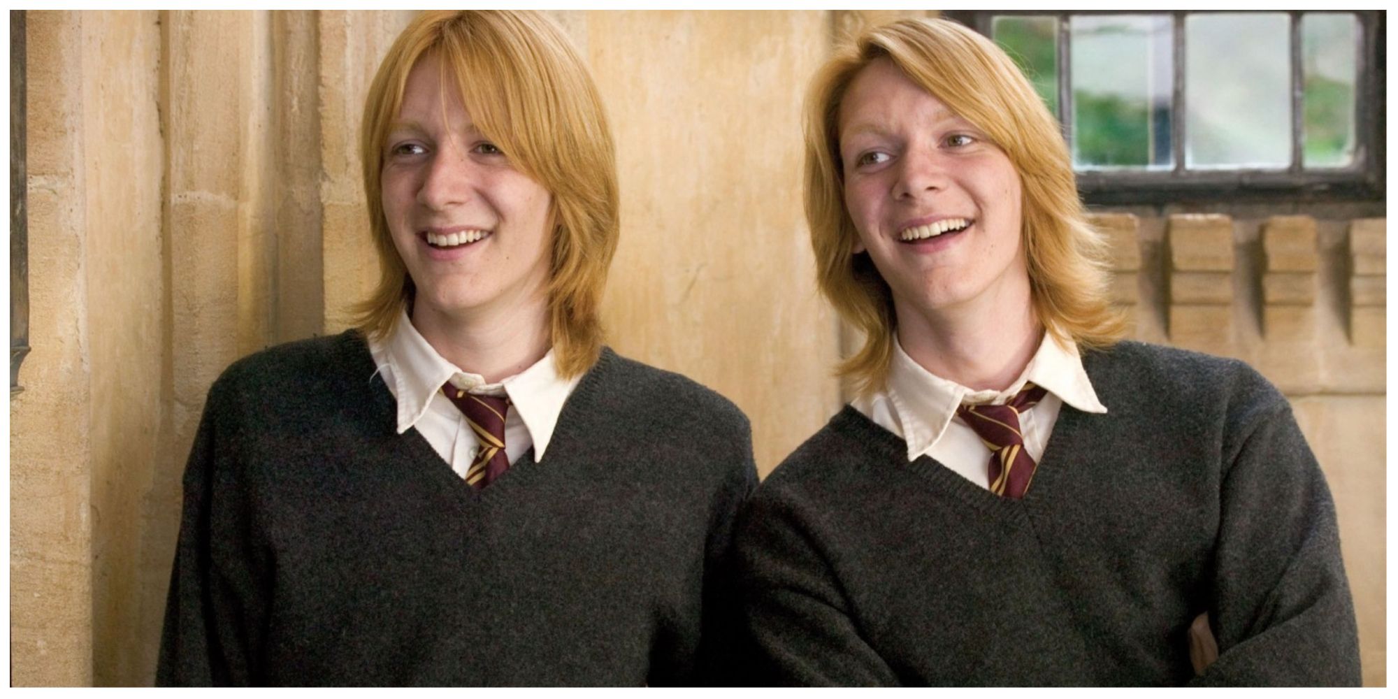 Fred and George Weasley in the fourth Harry Potter film laughing at their brother Ron off screen.