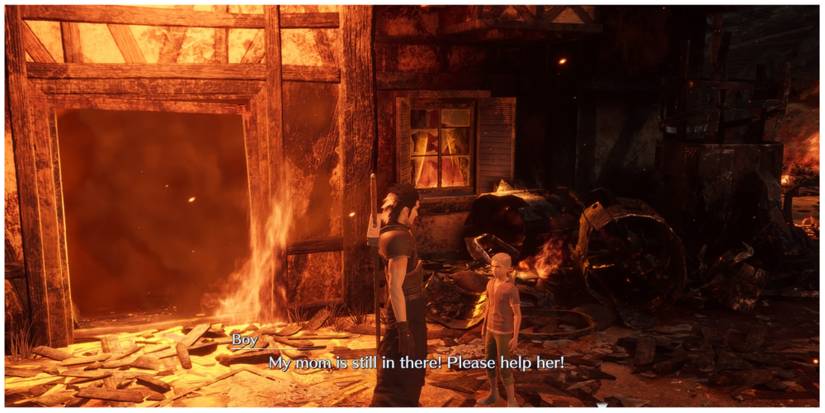 Zack stands outside a burning house in Crisis Core: Final Fantasy 7 Reunion