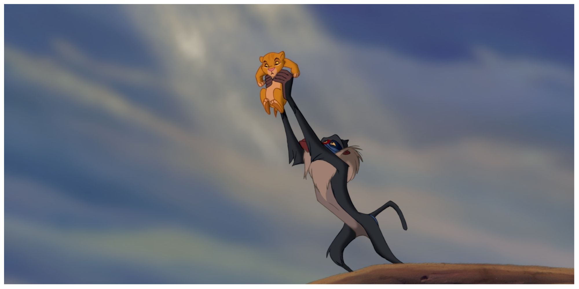 Rafiki holding up Simba on Pride Rock