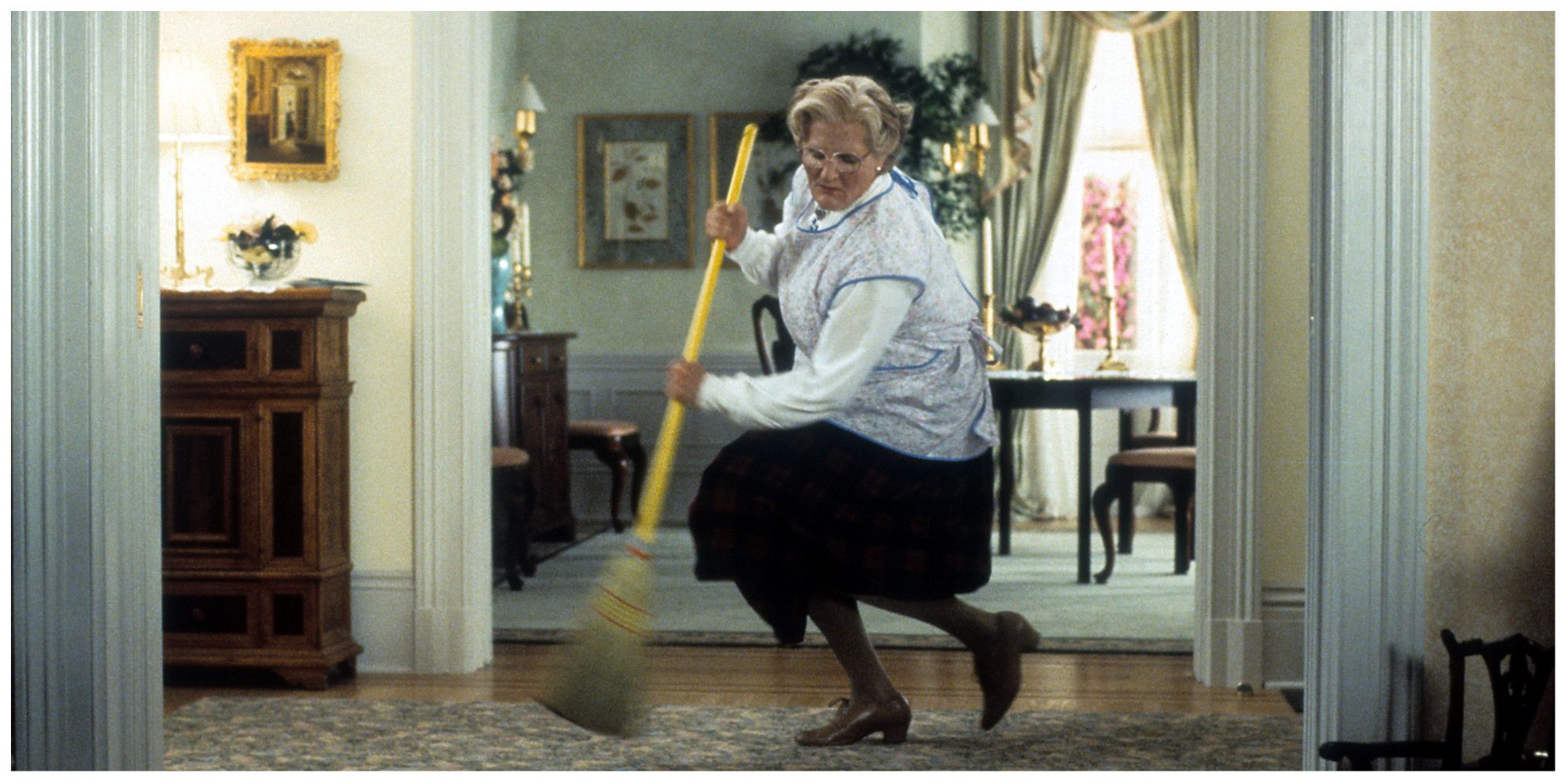 Mrs. Doubtfire sweeping in vibrantly in the family home