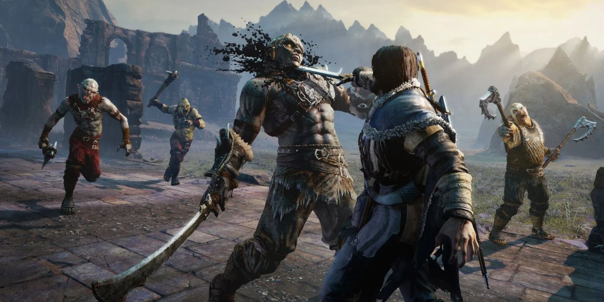 talion stabbing an orc with a sword
