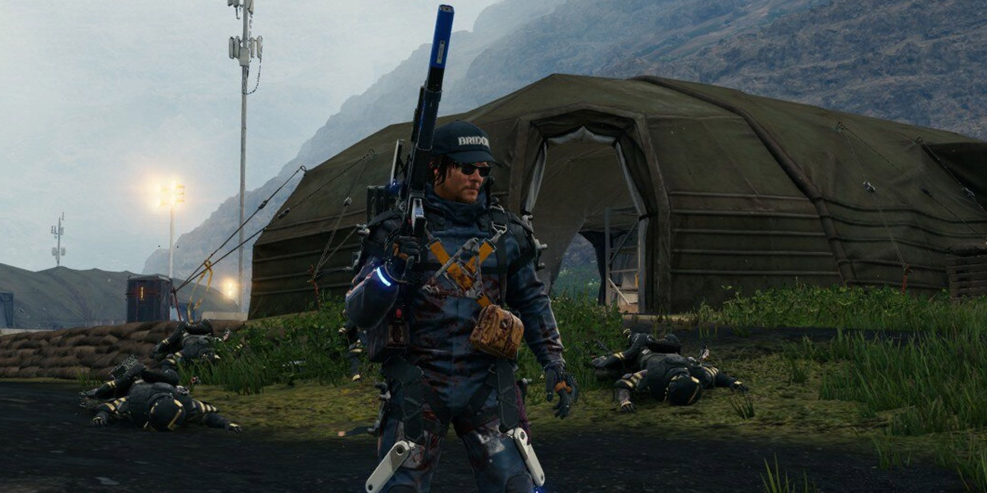 Death Stranding - Sam Holding Up Gun While All His Targets Are Down IN The Background