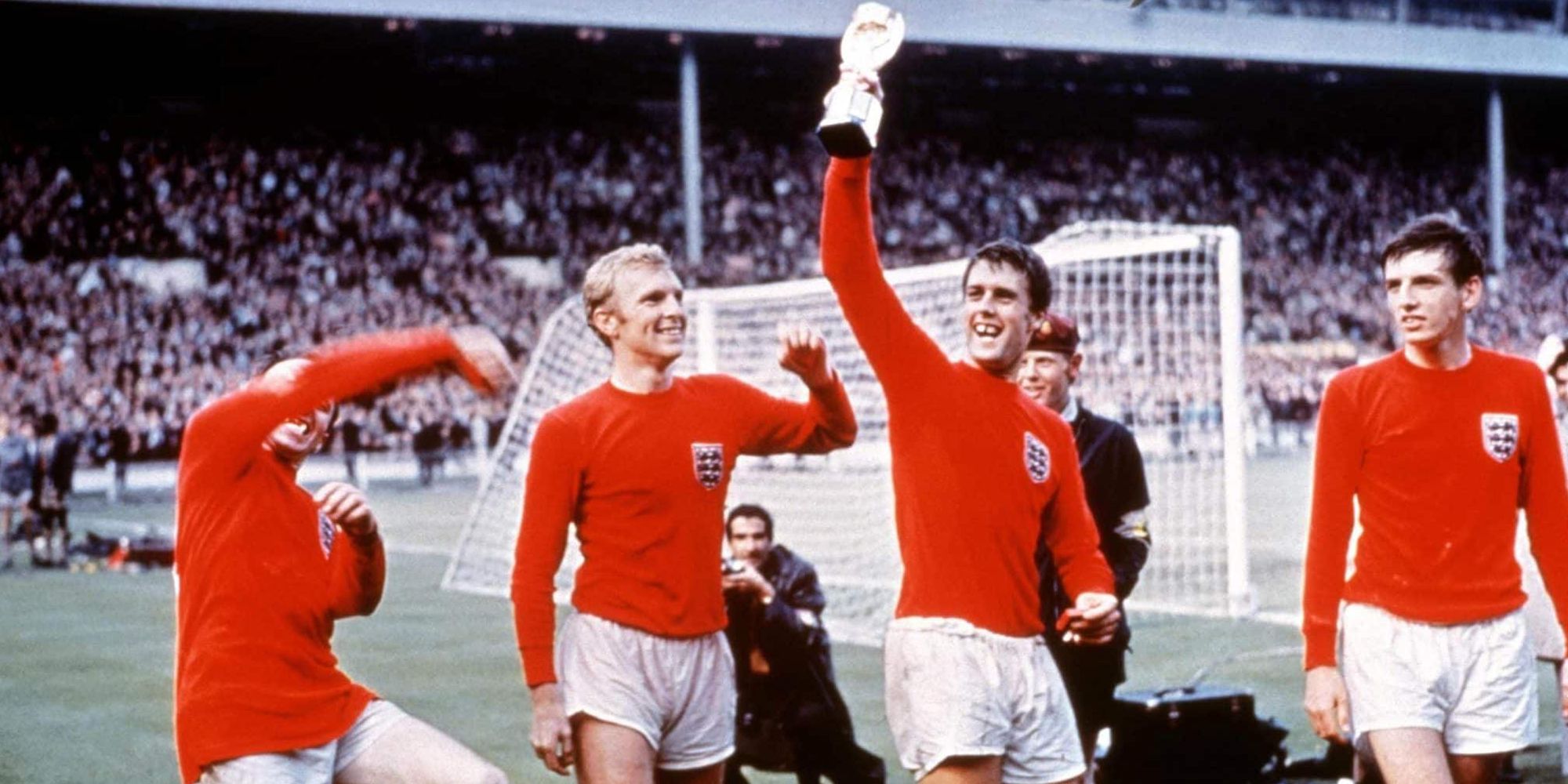 Geoff Hurst Holding The World Cup Trophy Along With Other Members Of The 1966 England Team