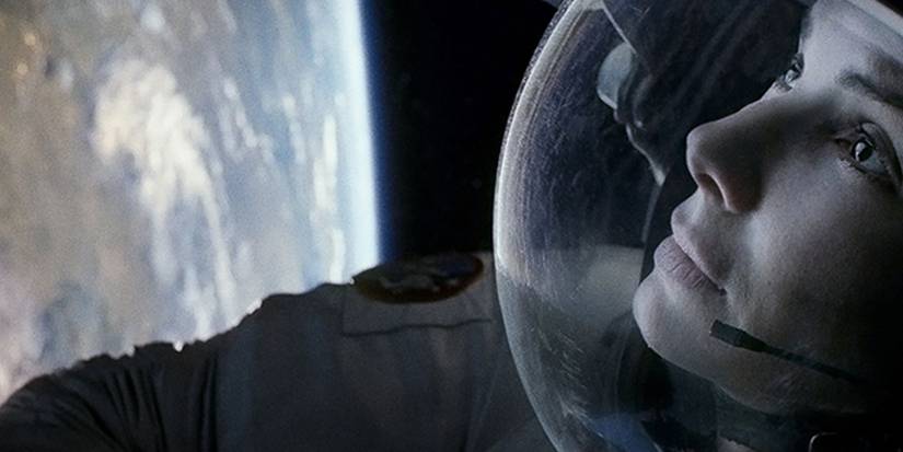 Sandra Bullock in a space suit looking at Earth in "Gravity"