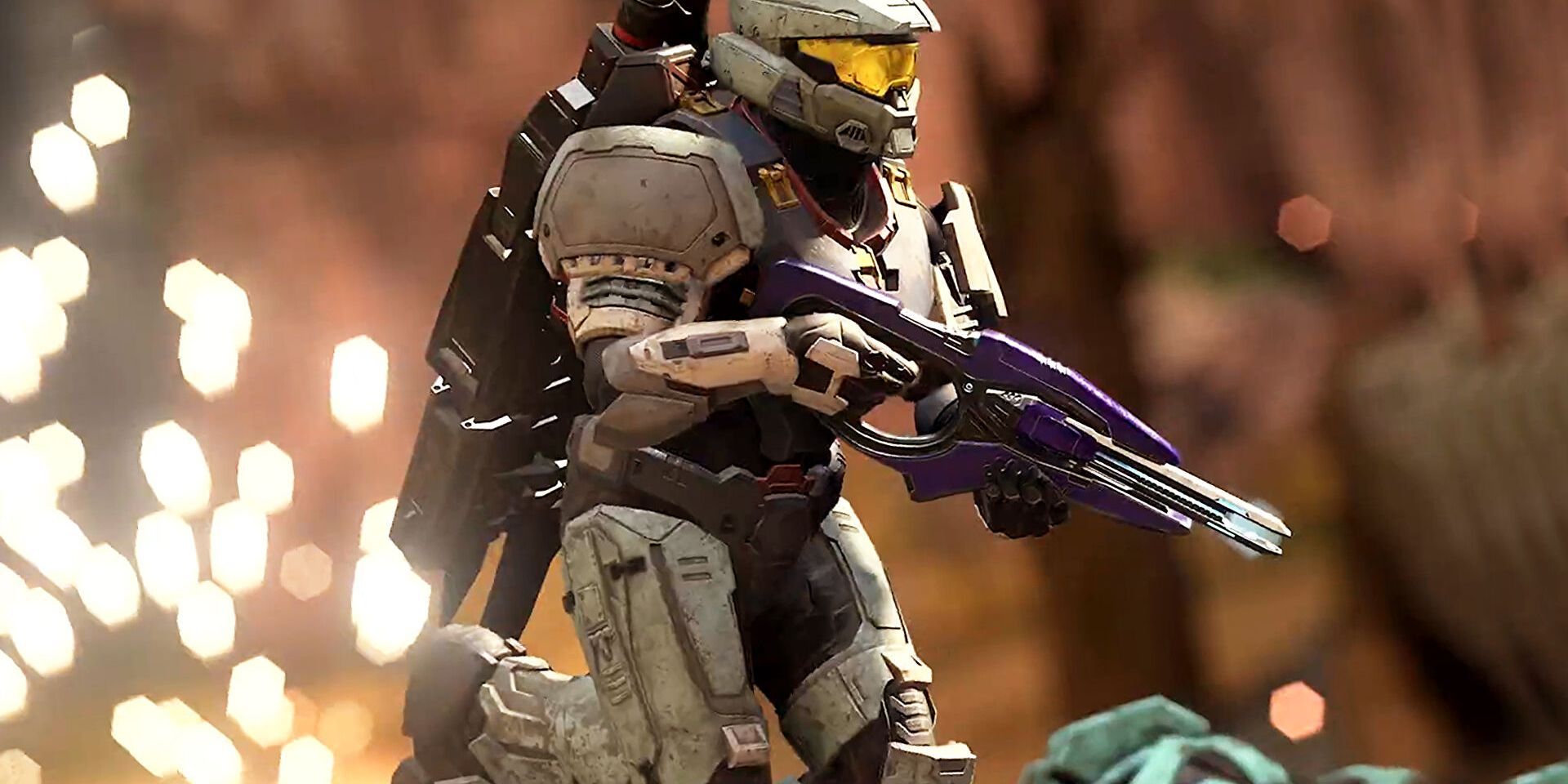 A promo image for Halo Infinite showing a player running with a rifle