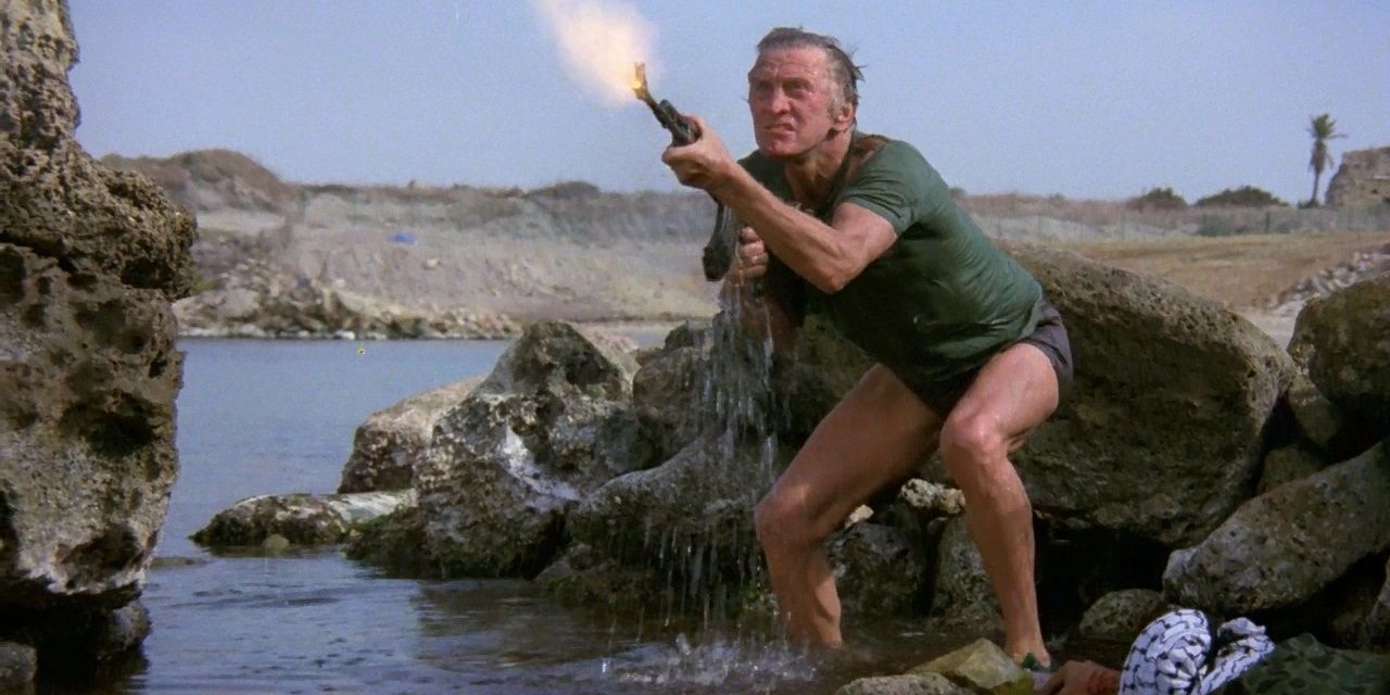 Kirk_Douglas_with_an_assault_rifle_in_The_Fury