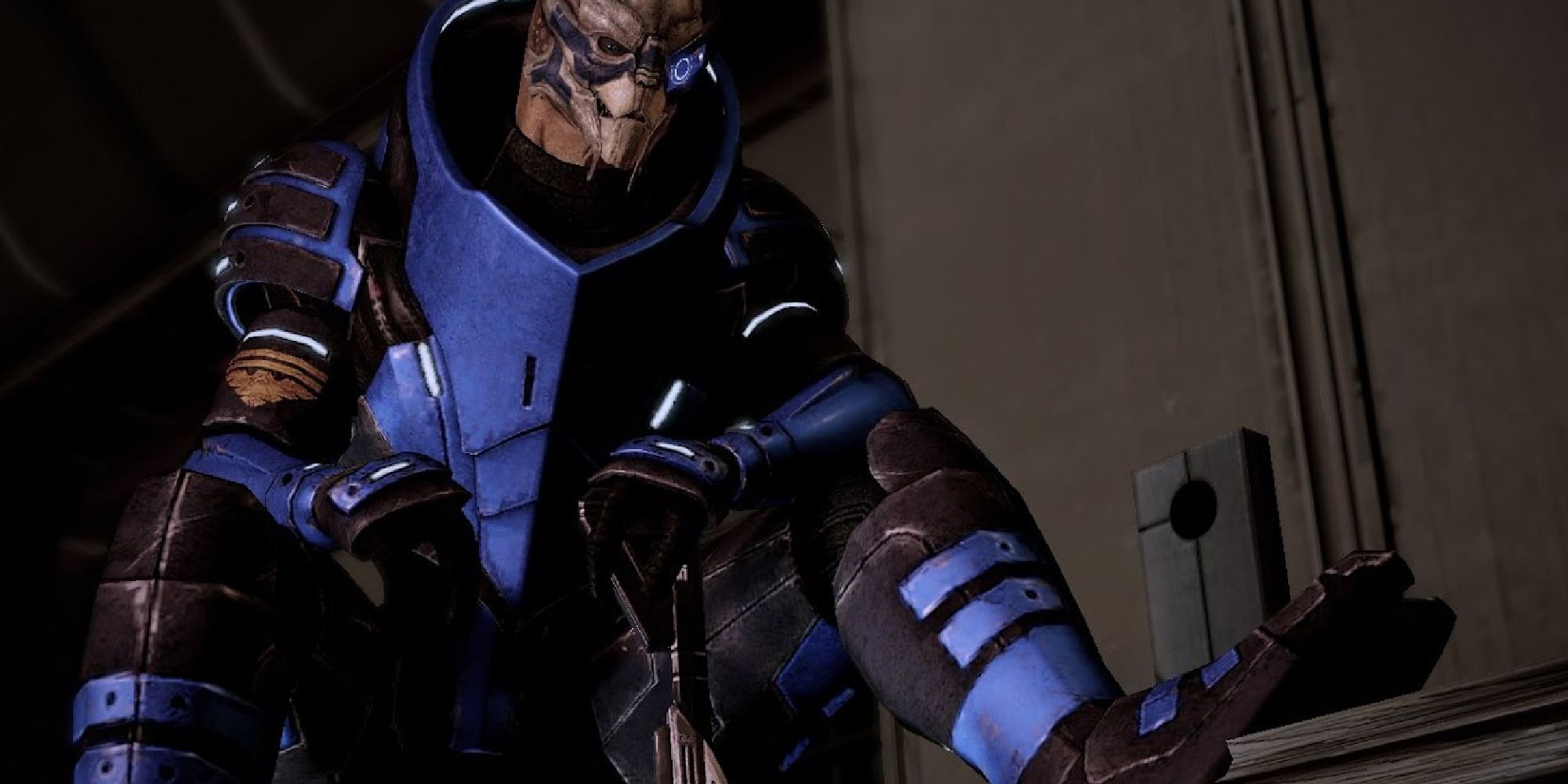 Garrus from Mass Effect 2 sitting with one foot propped up, resting his hand on his trusty sniper rifle