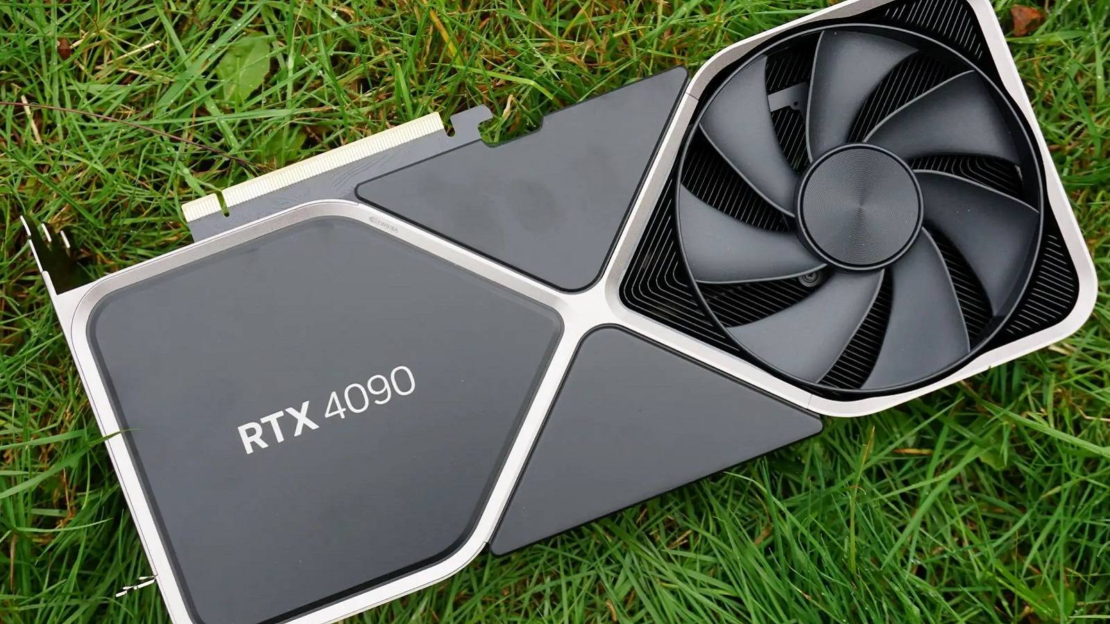 Photo of an Nvidia RTX 4090 graphics card on some grass.