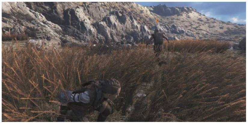 Amicia taking cover in A Plague Tale: Requiem