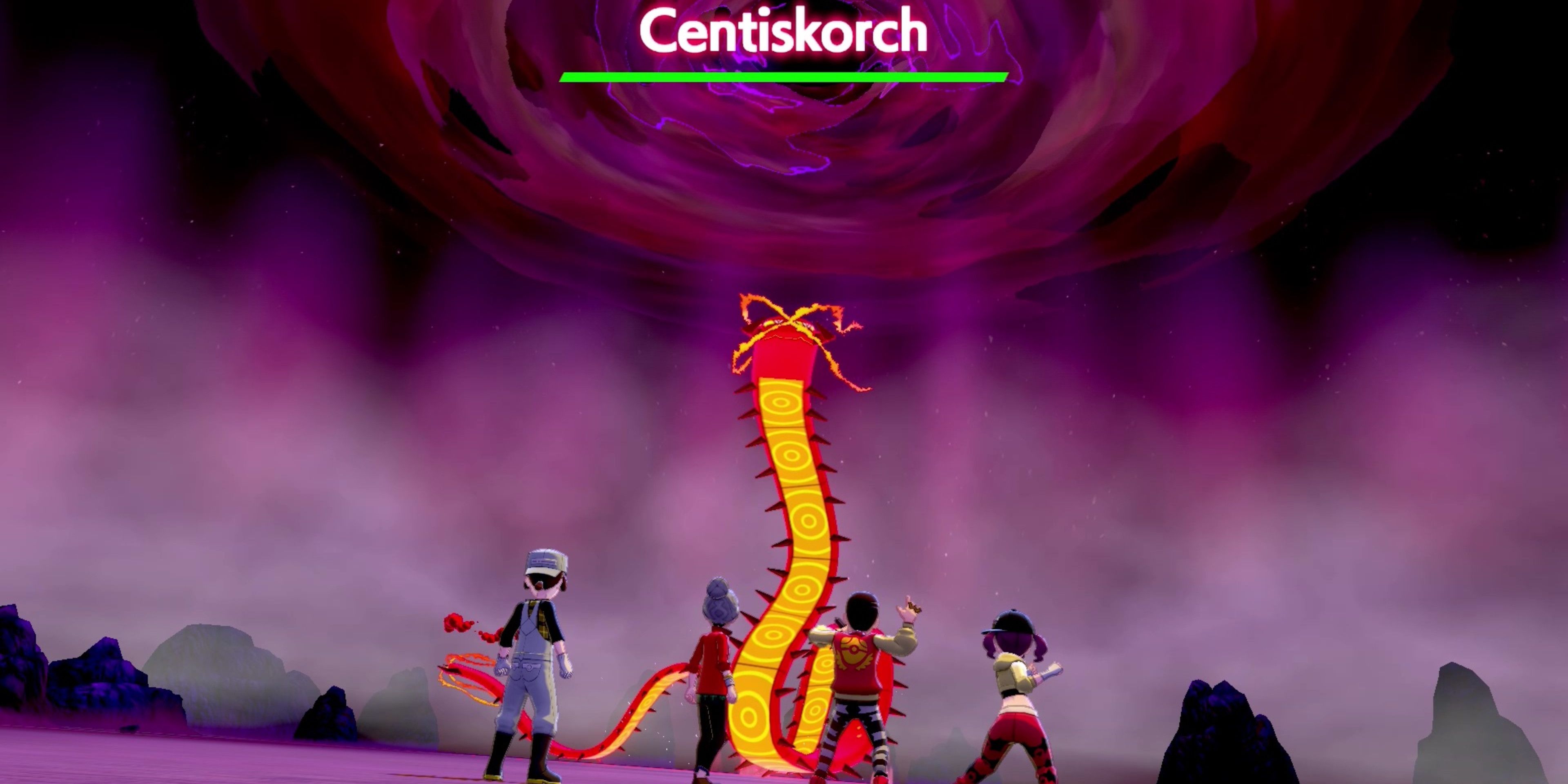 Trainers facing against Gigantamax Centiskorch in a Battle Den