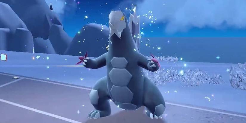 Baxcalibur sparkling after evolving on a snowy mountain