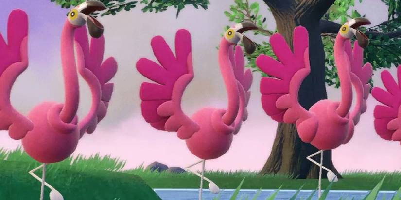 A group of Flamigo dancing in a lake near a tree